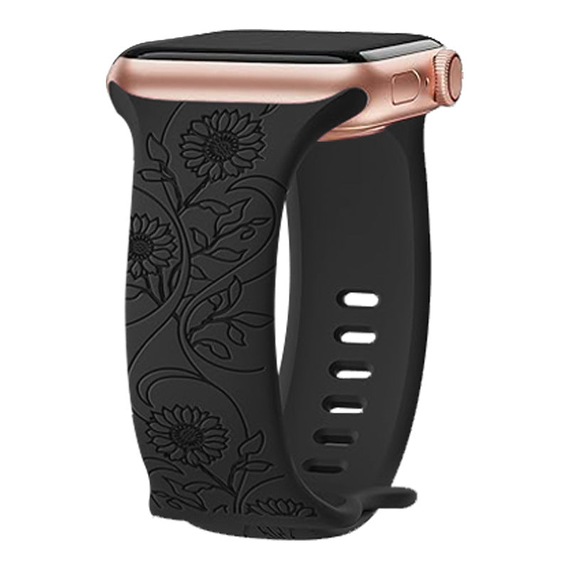 Black floral silicone Apple Watch band with rose gold aluminum case and embossed sunflower design