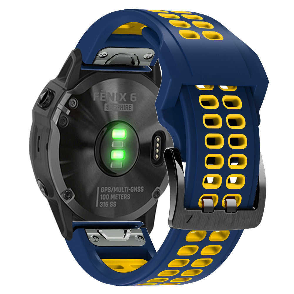 Fenix 6 Sapphire smartwatch with navy blue and yellow silicone sports band, green LED light indicator visible on black watch face, GPS multi-GNSS 100m water resistant