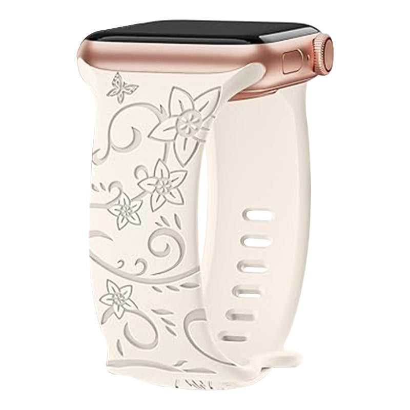 Cream floral silicone Apple Watch band with rose gold connector and engraved flower vine design