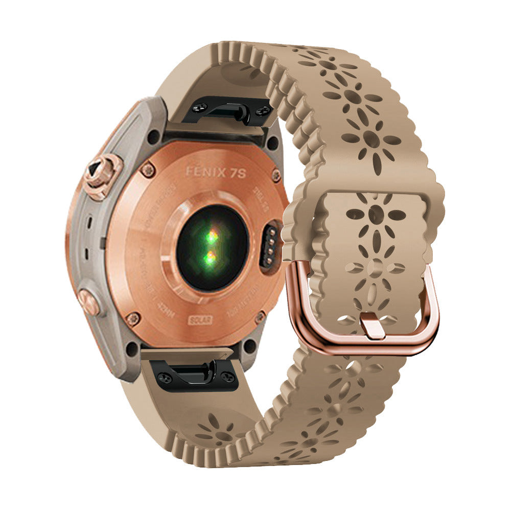 Garmin Fenix 7S smartwatch with rose gold hardware and beige floral silicone QuickFit 20mm band strap
