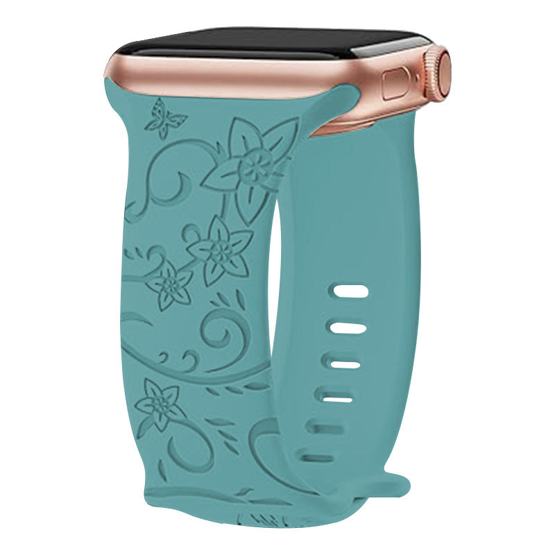 Teal floral silicone band for Apple Watch with rose gold case and adjustable strap with ventilation holes