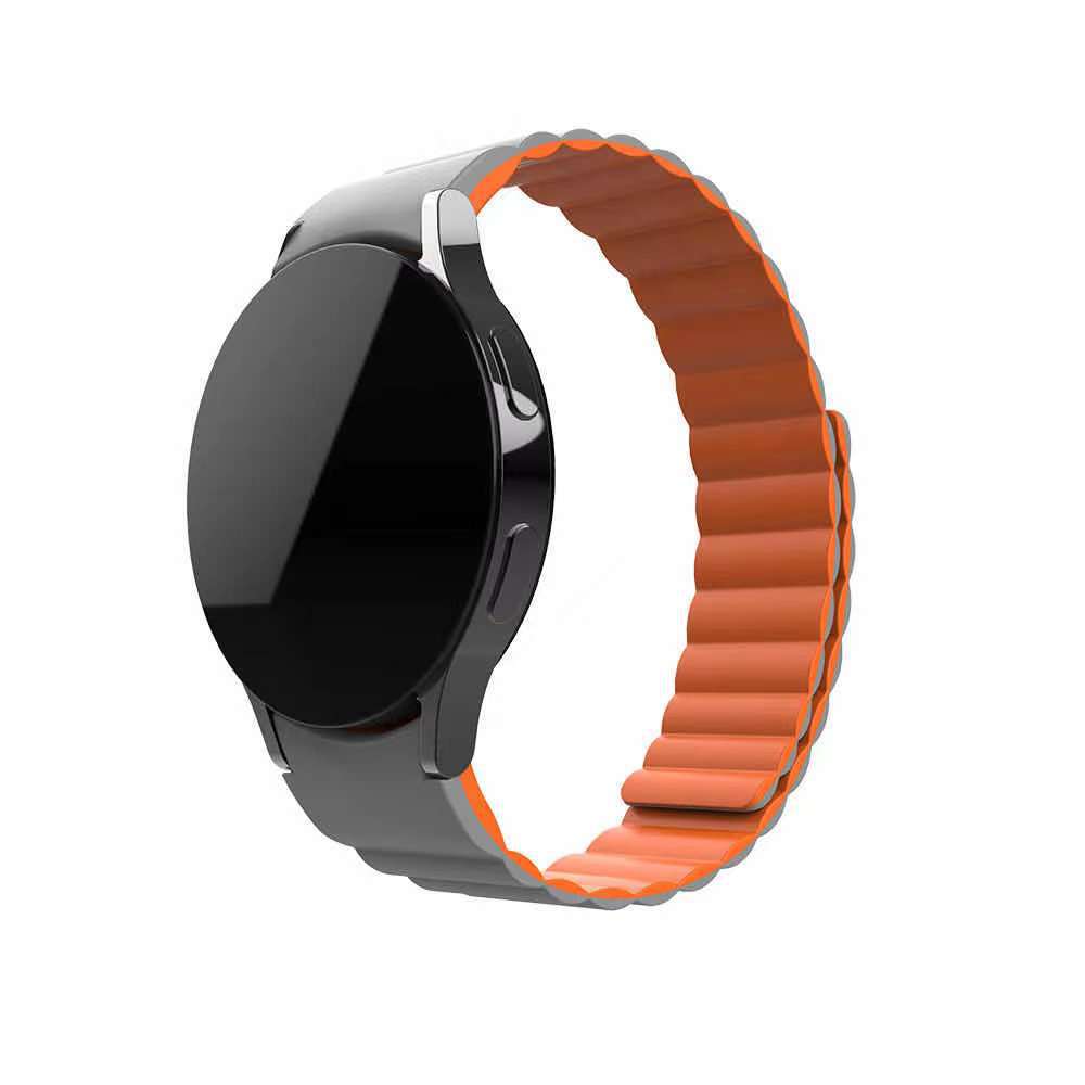Black smartwatch with orange magnetic silicone link band, gapless design for Galaxy Watch and Vivomove HR
