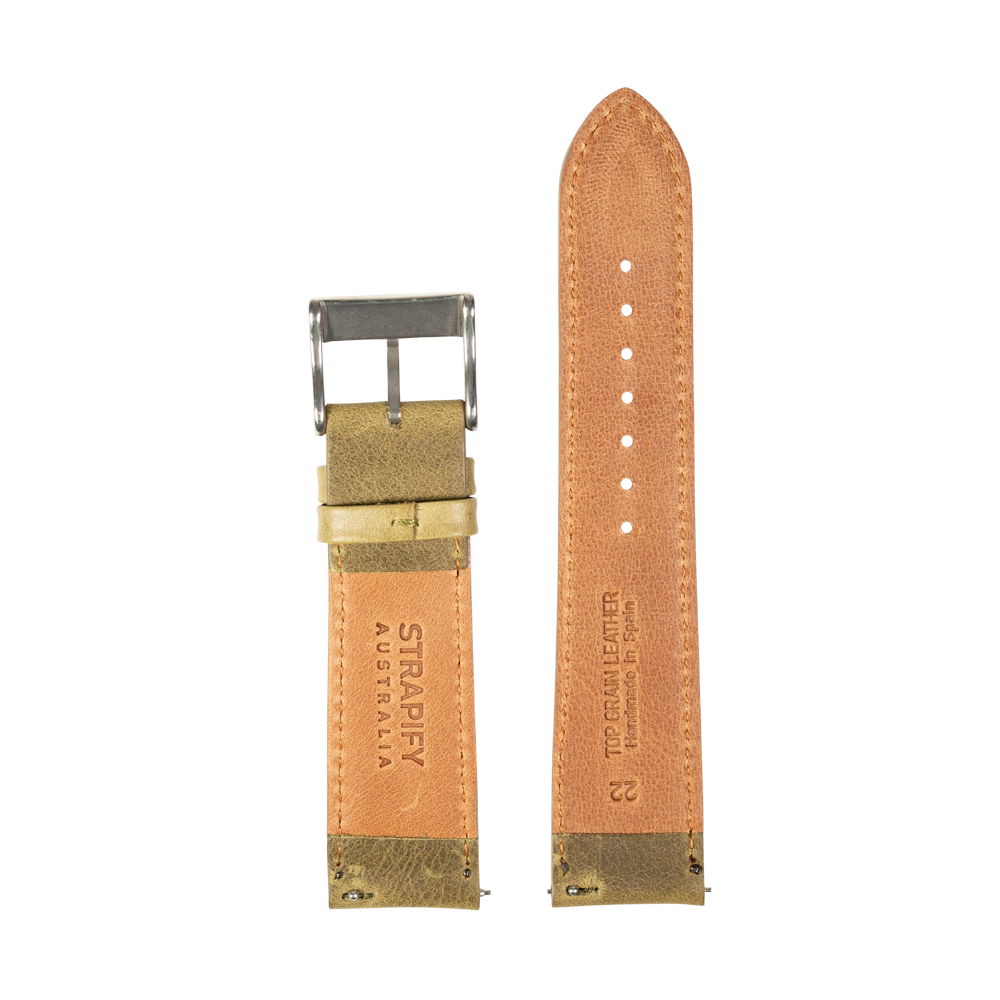 Tan leather watch band with olive green accents and silver buckle, showing front and back sides with perforations