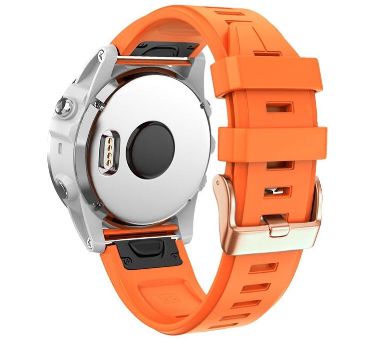 Orange silicone smartwatch band with rose gold buckle hardware, featuring quick-fit 20mm connector system