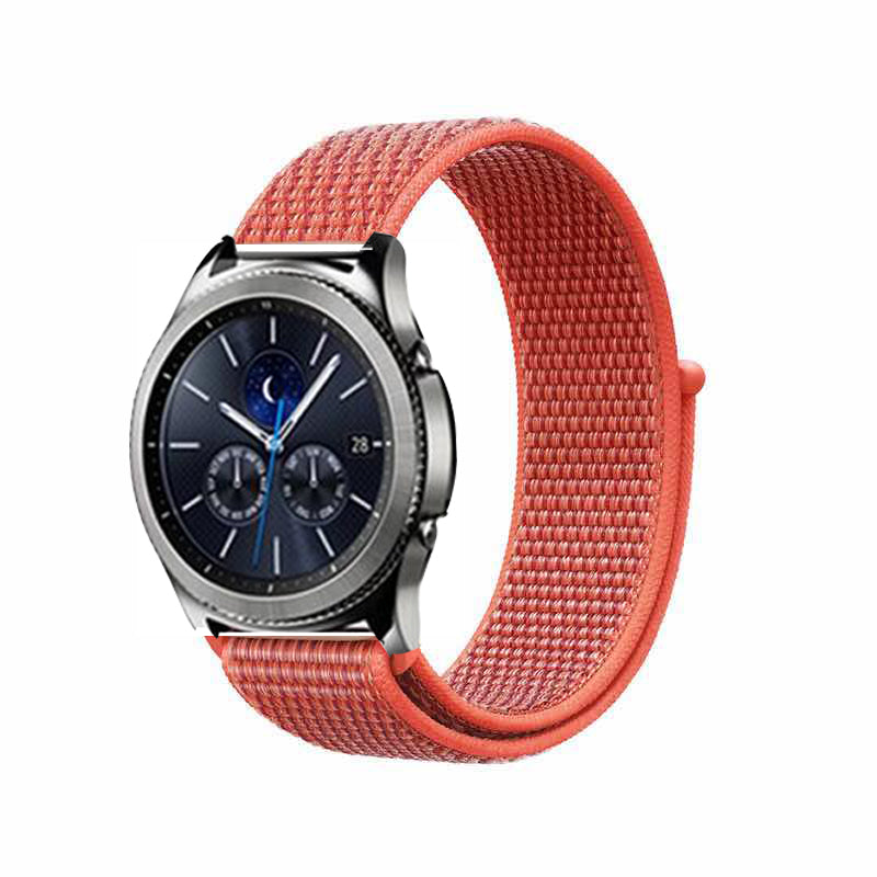 Smartwatch with silver case and dark blue chronograph dial featuring coral red woven sports loop velcro band