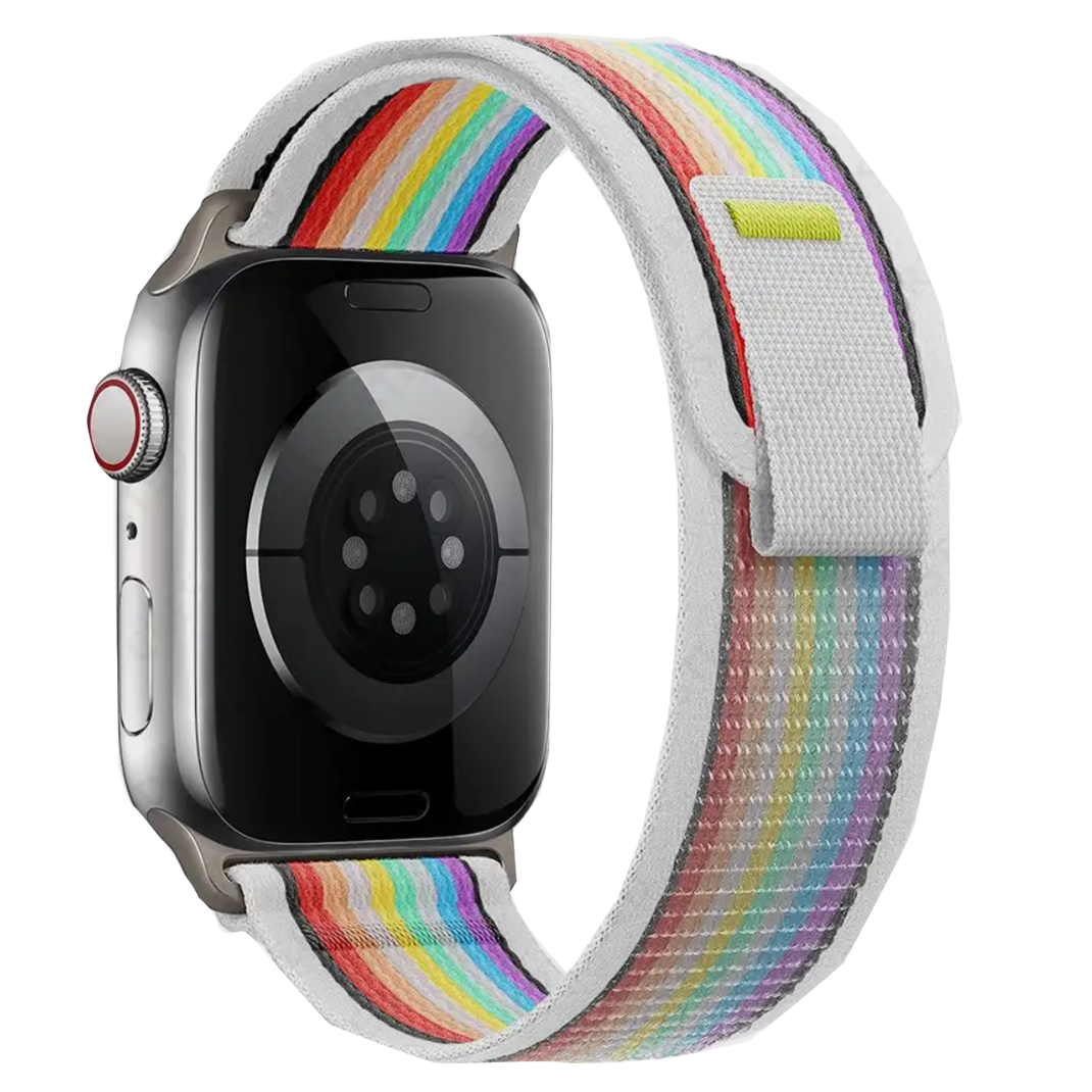 Silver stainless steel smartwatch with rainbow striped fabric loop band and red digital crown