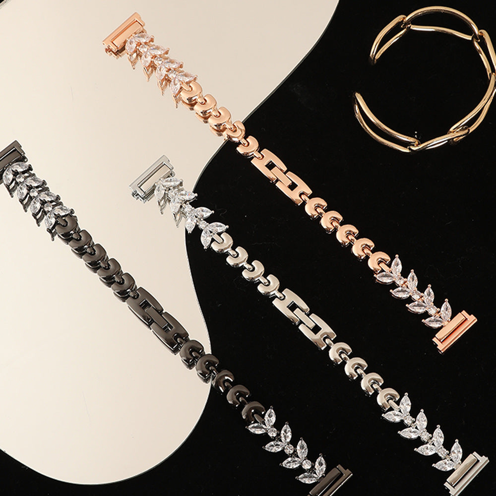 Rose gold, silver and black crystal link bracelets with quick release clasps displayed on contrasting backgrounds