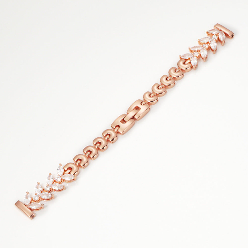 Rose gold tennis bracelet with marquise cubic zirconia stones and polished link chain design, elegant luxury bracelet