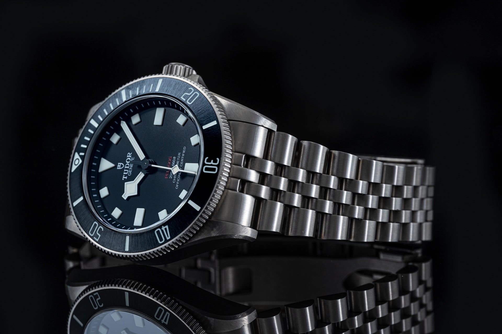 Titanium bracelet with polished and brushed links for Tudor Pelagos 39mm watch, featuring secure clasp on black background