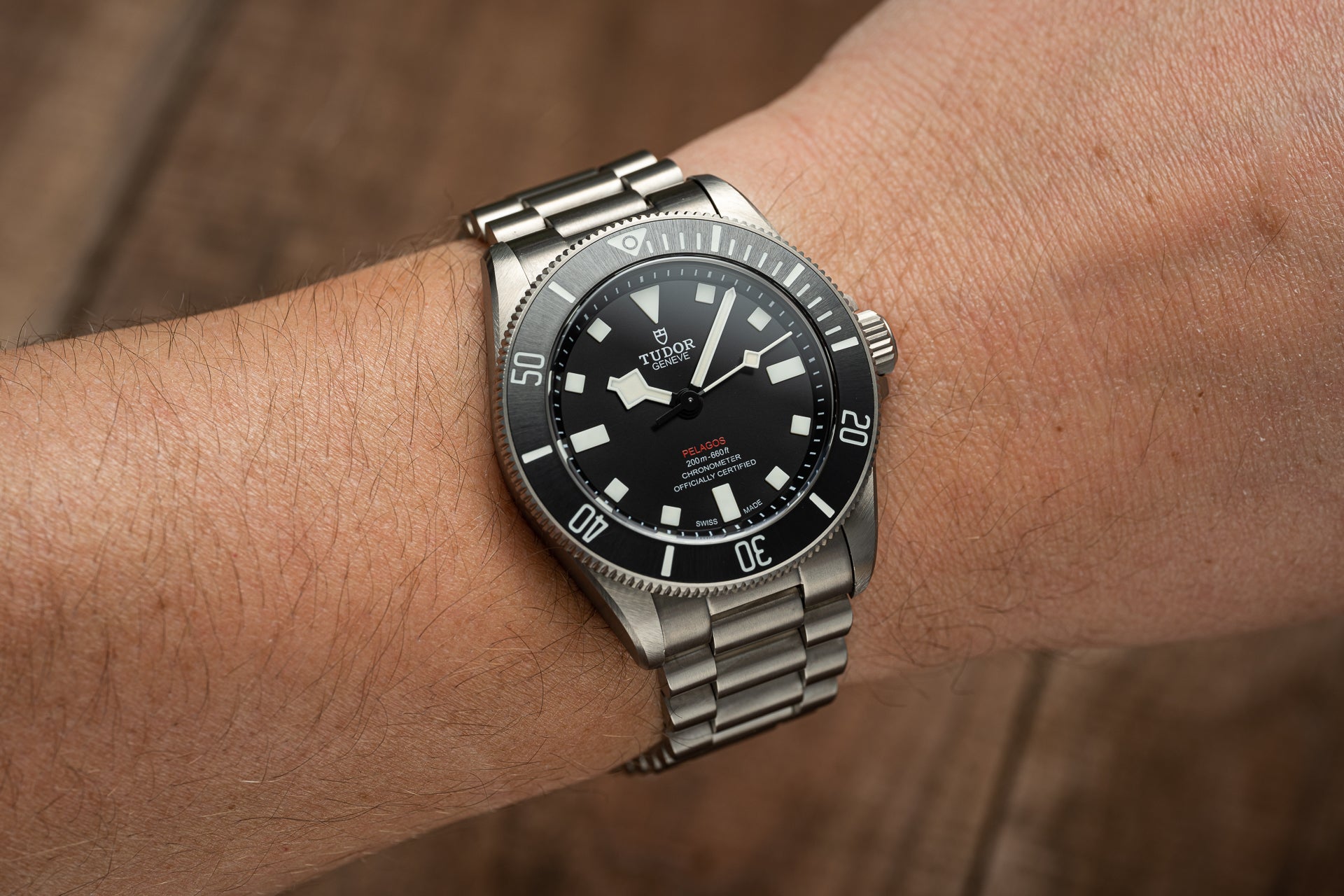 Tudor Pelagos 39mm stainless steel dive watch with black dial and rotating bezel on wrist