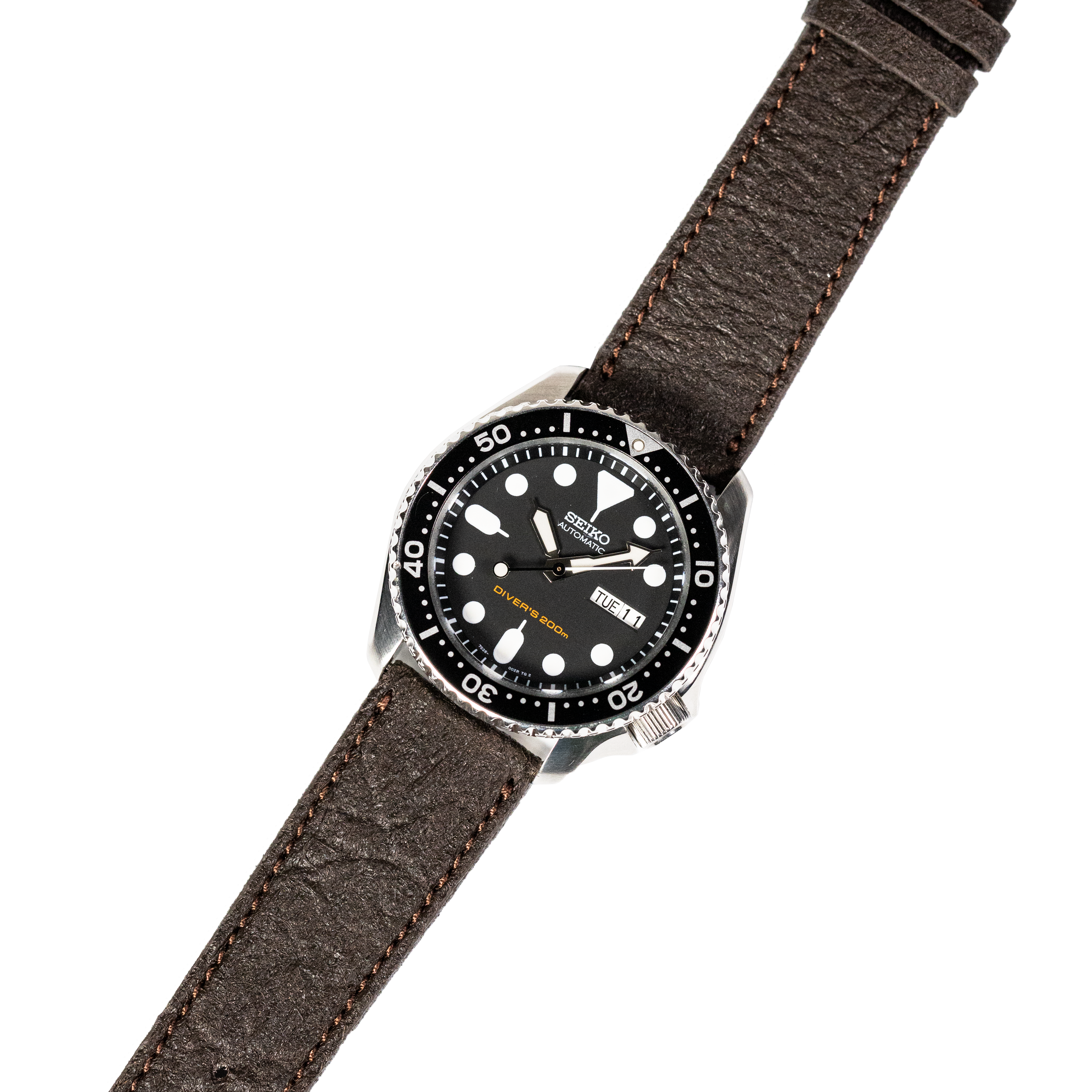 Seiko automatic dive watch with black dial on dark brown vegan leather strap