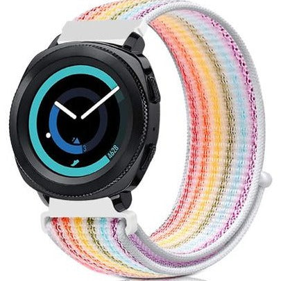 Black smartwatch with gradient blue dial face paired with colorful striped velcro sports loop band in rainbow pastels