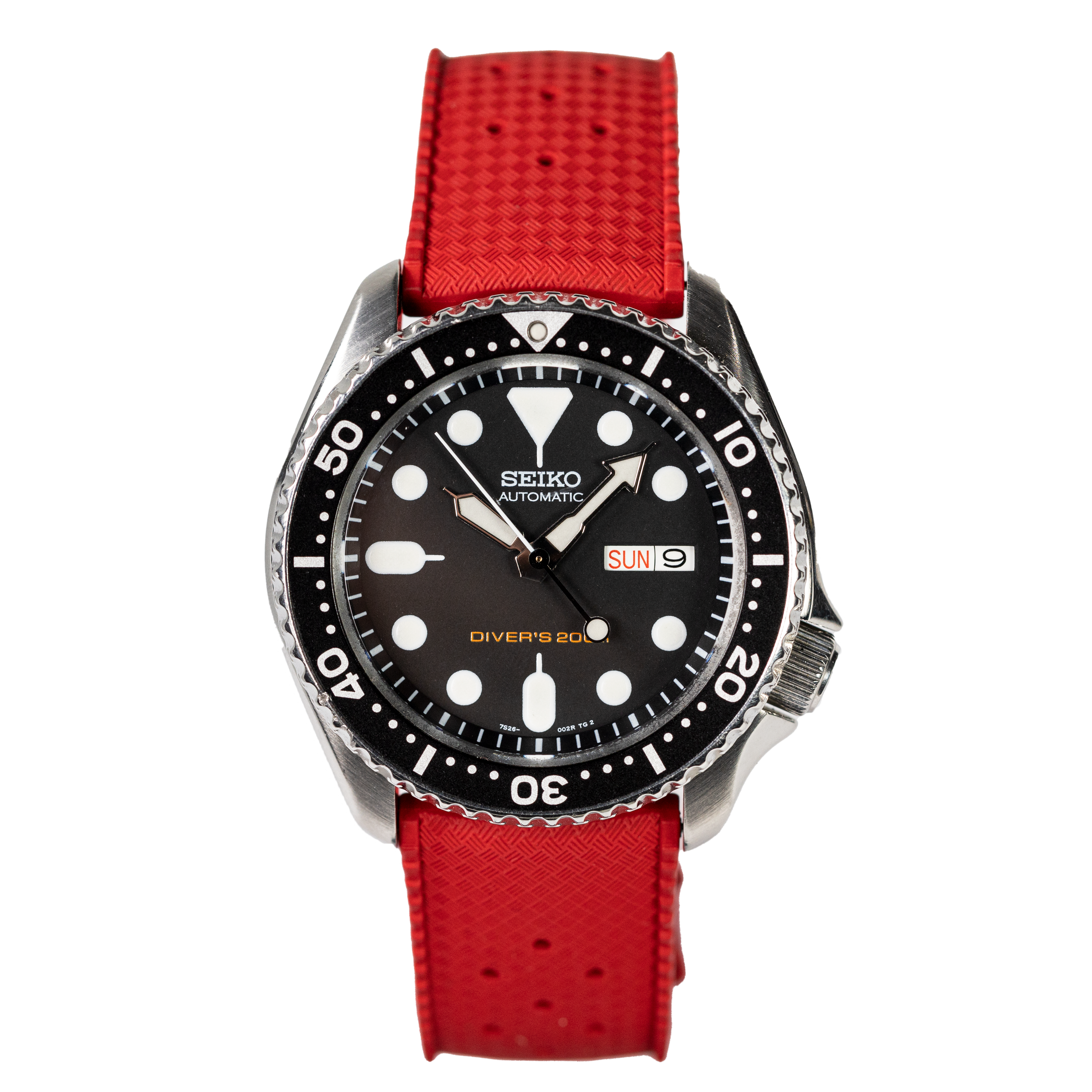 Seiko automatic diver's watch with black dial, stainless steel case, and red rubber strap