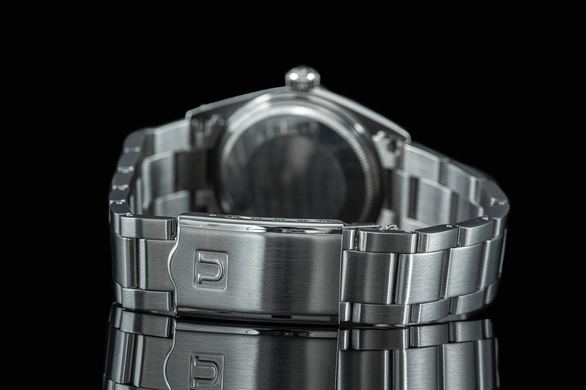 Stainless steel Senator bracelet for Rolex Datejust 1601 and 1603 watches, shown with fold-over clasp on black background