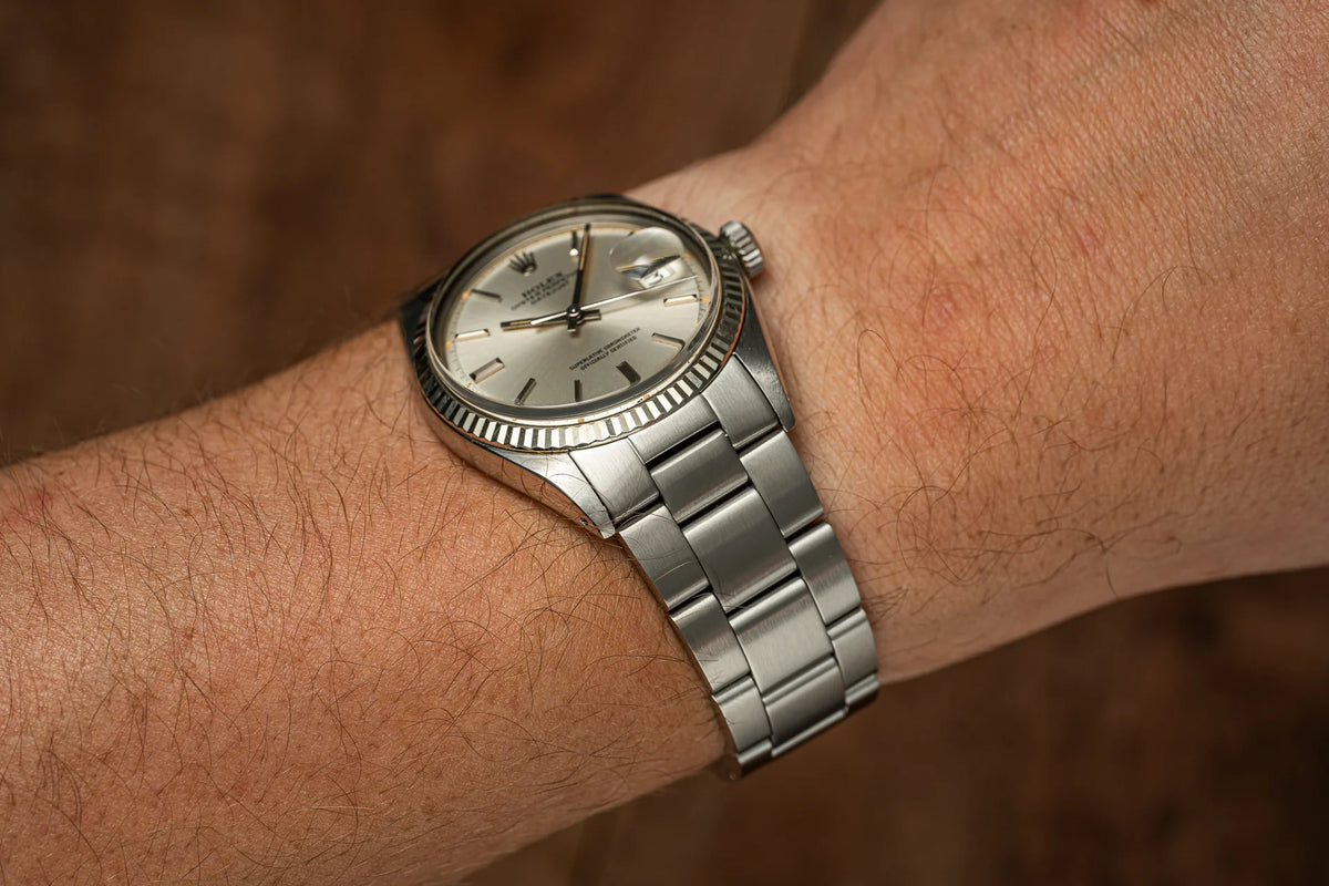 Stainless steel Uncle Senator bracelet on vintage Rolex Datejust watch with fluted bezel and silver dial worn on wrist