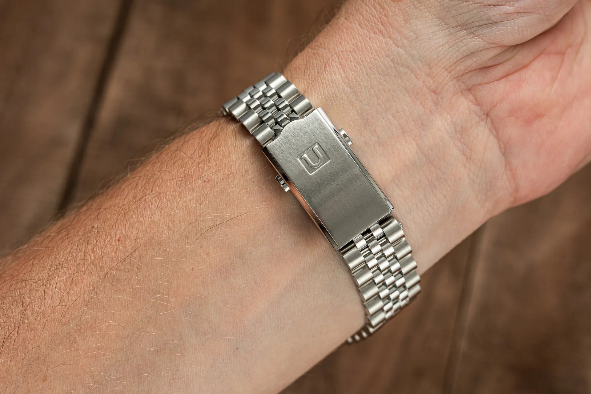 Stainless steel bracelet with solid link design and brushed finish, worn on wrist, compatible with Rolex Explorer 114270