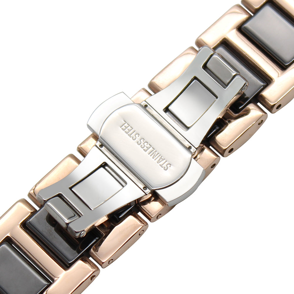 Two-tone rose gold and black ceramic bracelet with quick release clasp mechanism, close-up detail view