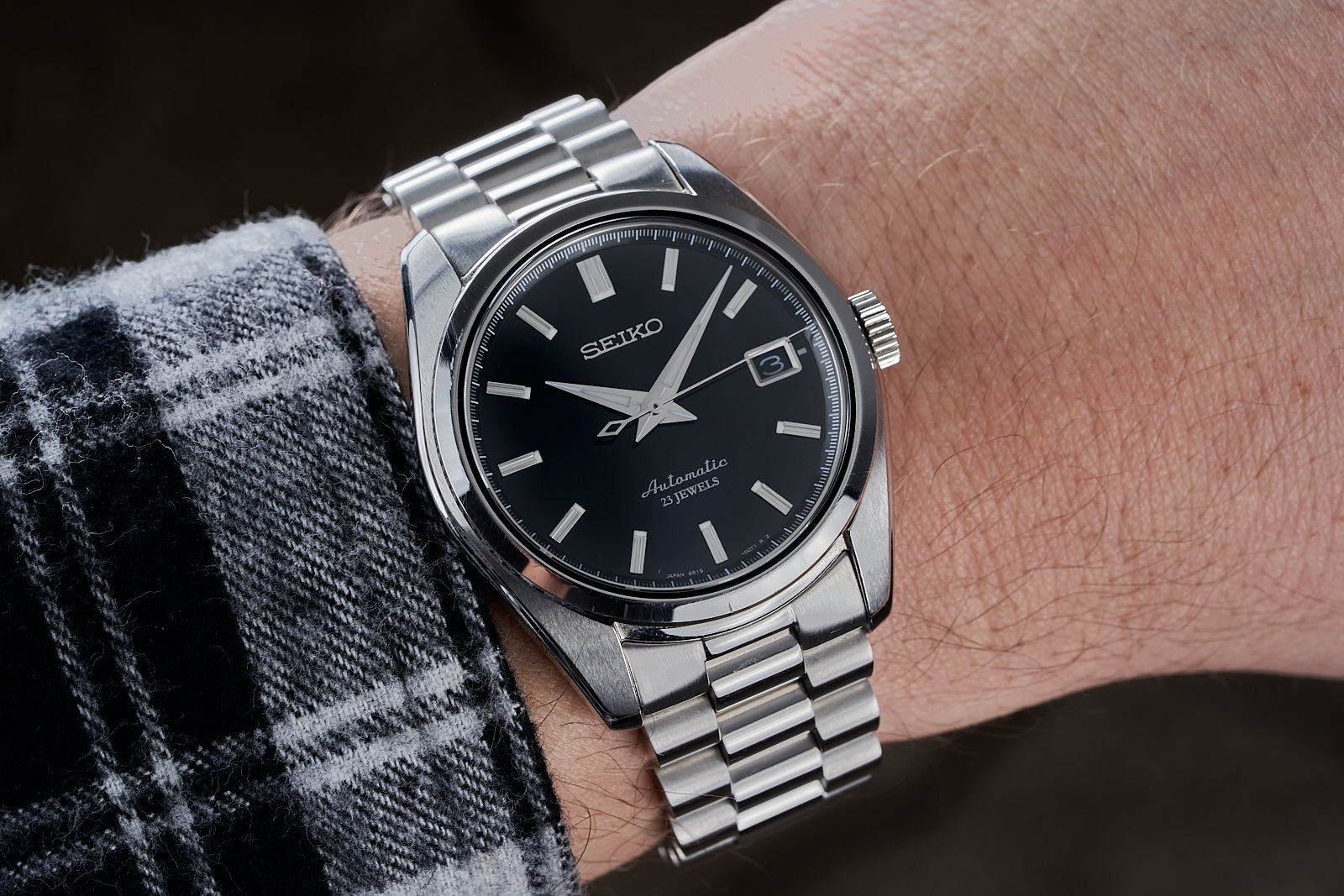 Seiko SARB automatic stainless steel watch with black dial and date window on wrist