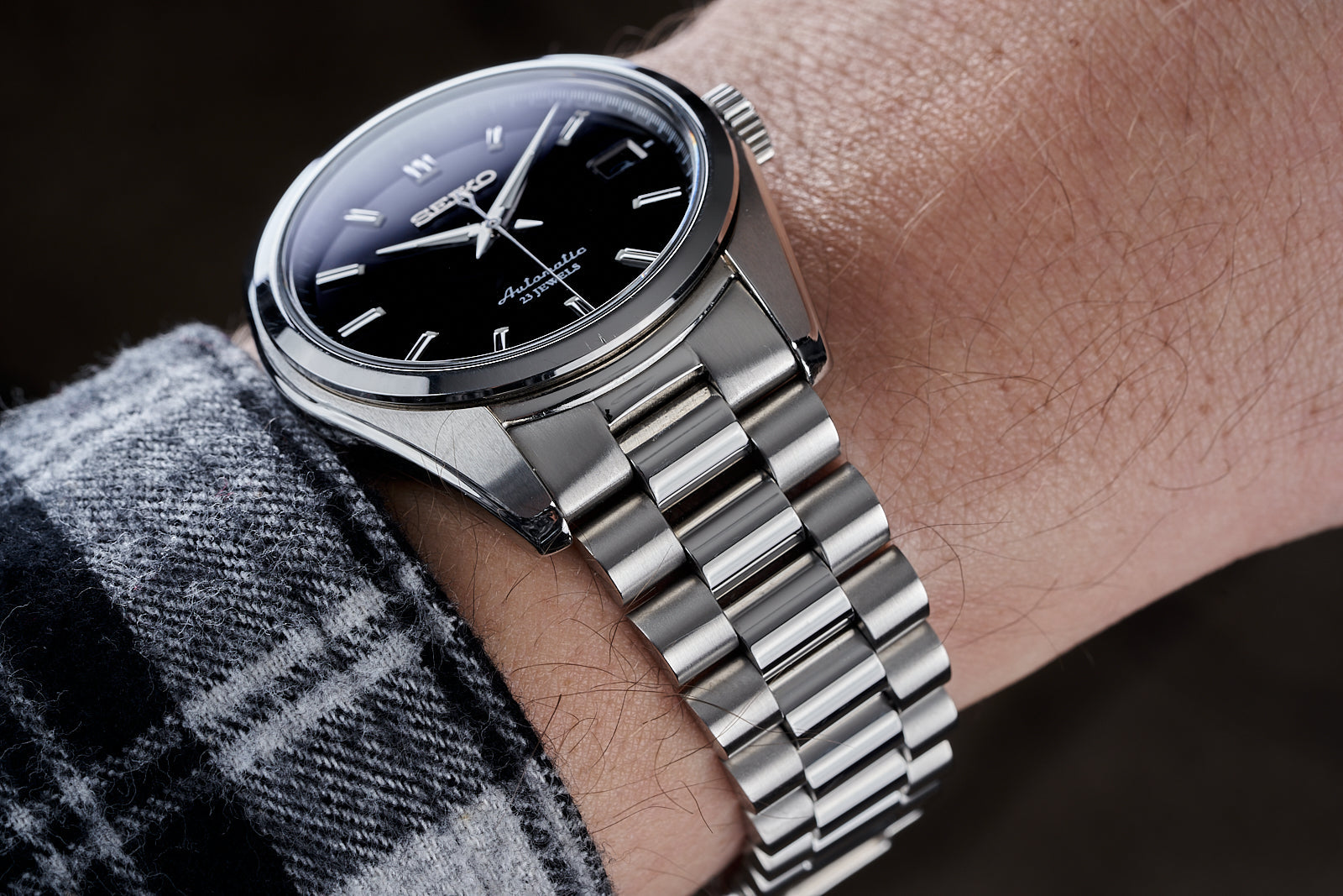 Seiko SARB automatic watch with black dial and stainless steel bracelet on wrist