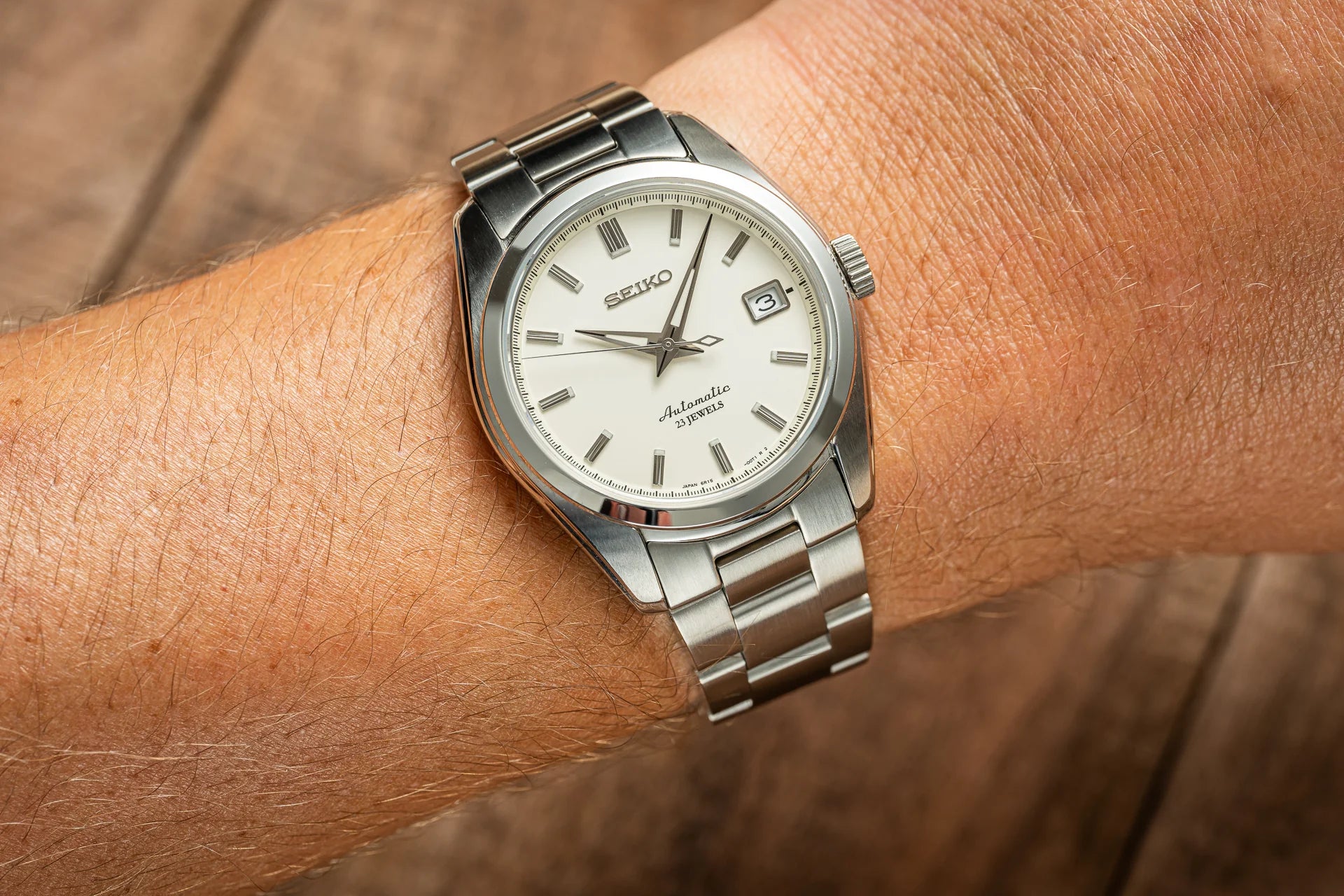 Seiko Sarb automatic stainless steel watch with white dial and date window on wrist