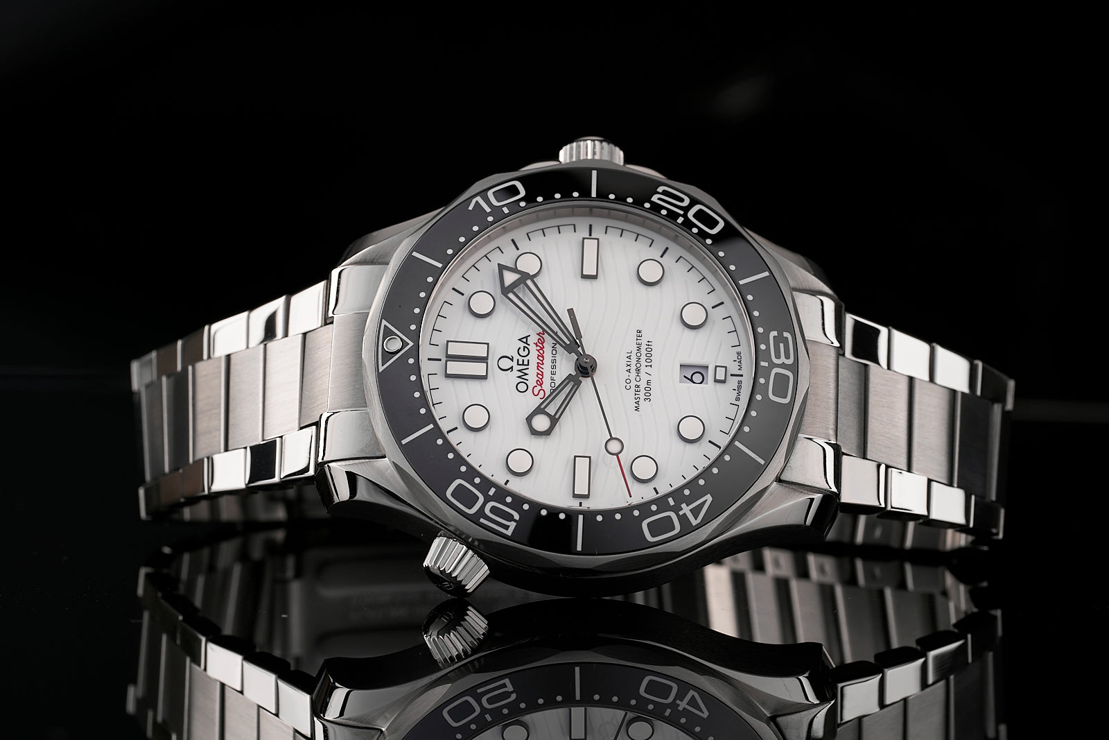 Omega Seamaster 300m stainless steel dive watch with white dial, black bezel, and flat link bracelet on black background