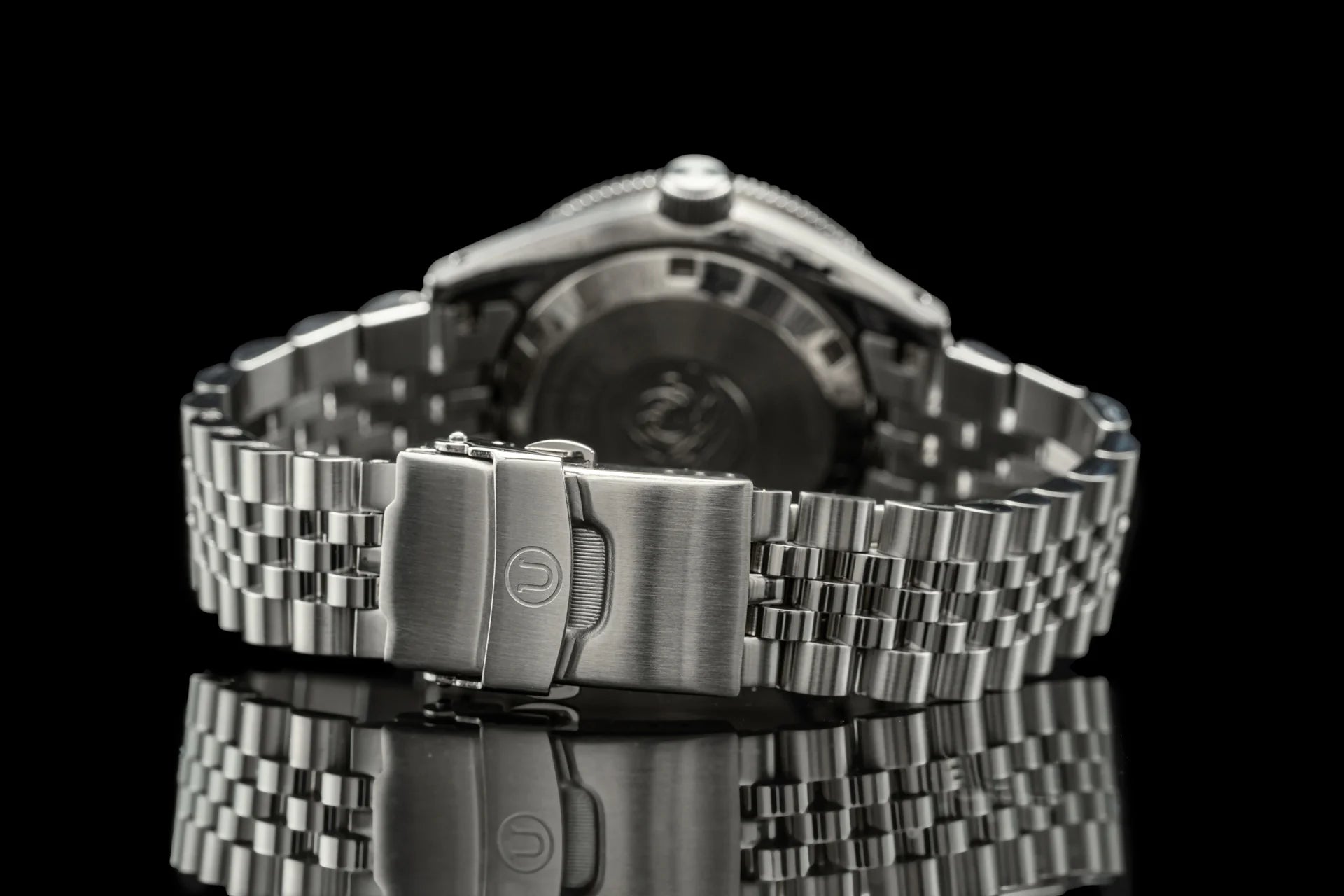 Seiko SPB45x stainless steel executive watch with bracelet and fold-over clasp on black background