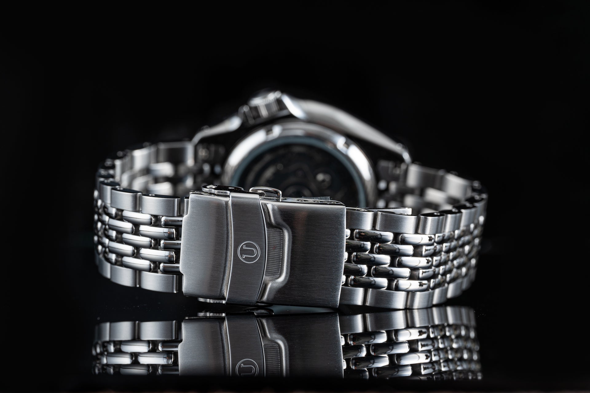 Stainless steel beads of rice bracelet with fold-over clasp for Seiko automatic dive watch, close-up detail shot