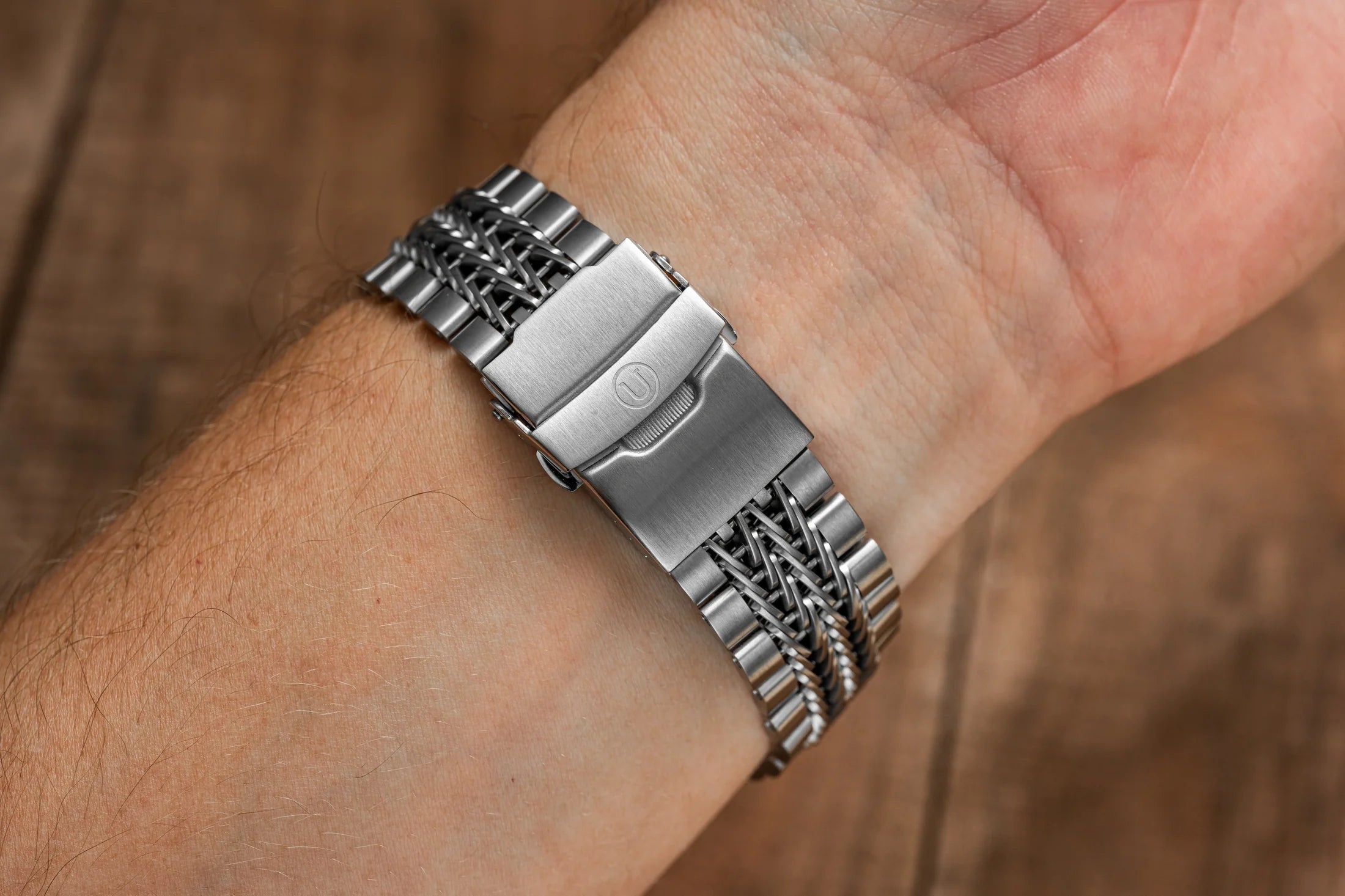Stainless steel Razor-Wire bracelet with solid end links worn on wrist, featuring polished and brushed finish compatible with Seiko Samurai watches