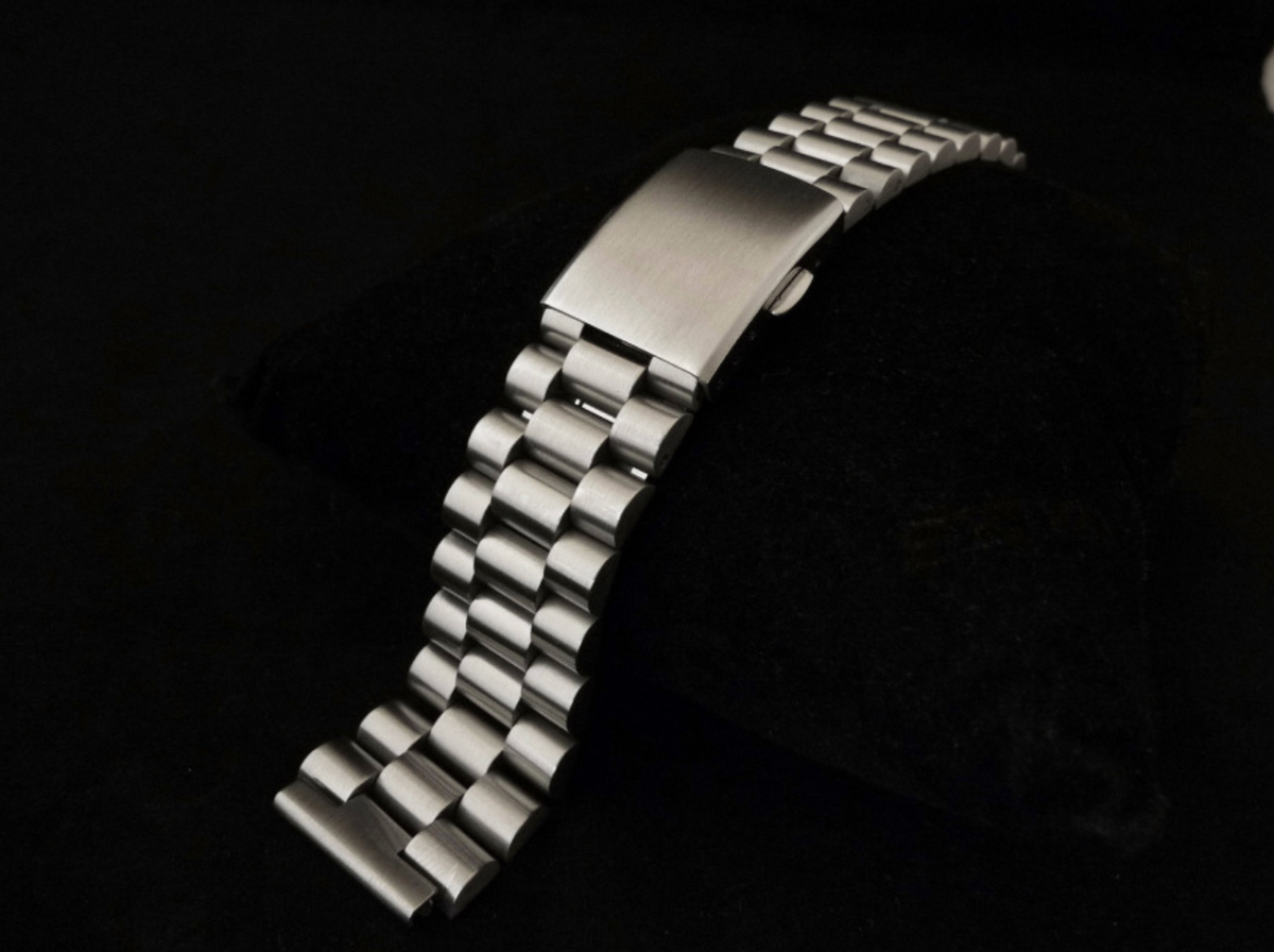 Stainless steel watch bracelet with solid link construction and fold-over clasp, compatible with Seiko Bell-Matic models