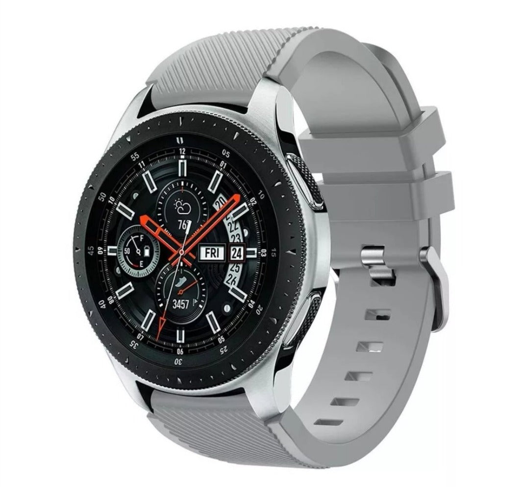 Silver stainless steel smartwatch with black dial, red hands, gray silicone band, and activity tracking display showing date and step count