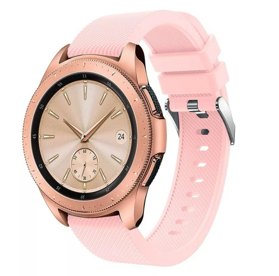 Rose gold smartwatch with pink silicone band featuring textured dial and sub-second hand display