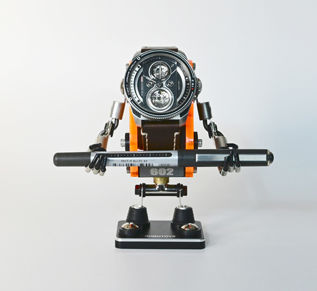 RoboToys Minibot neon orange watch stand with black leather strap watch, articulated arms and base display holder