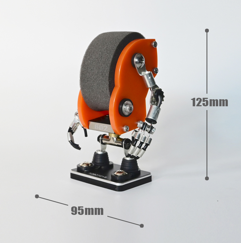 Orange RoboToys Minibot watch stand with gray grinding wheel, articulated arms, and black base, 125mm height x 95mm width