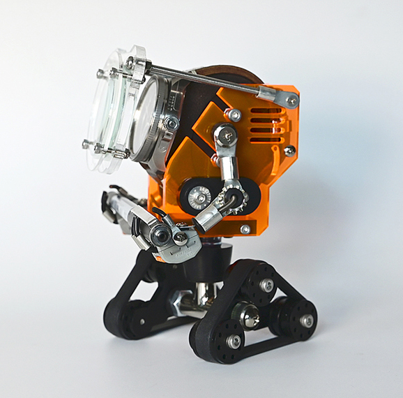 RoboTank neon orange watch stand with articulated black treads and mechanical details on white background