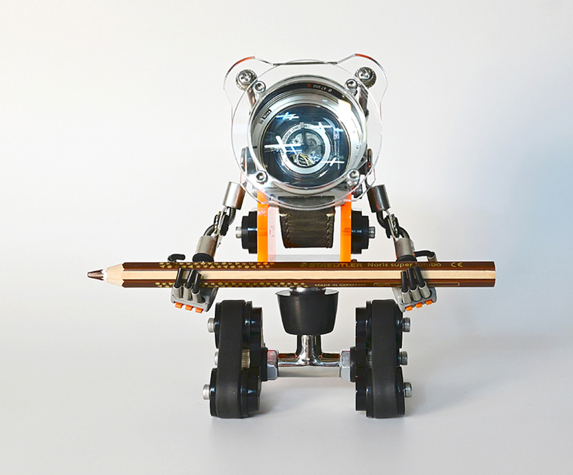 RoboTank watch stand with neon orange accents holding pencil, transparent dome display head, black wheels on white background