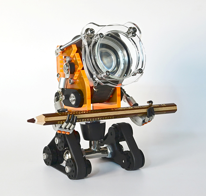 Orange robotic watch stand with camera lens design, pencil holder, and wheeled base on white background