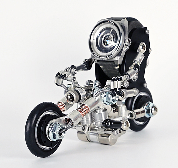 Steampunk robot motorcycle watch stand with silver metal engine detail and black rubber wheels