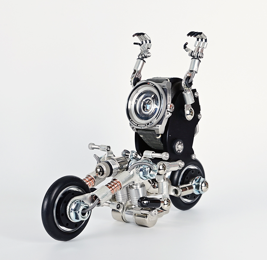Steampunk robot motorcycle watch stand with articulated metal arms and black rubber wheels