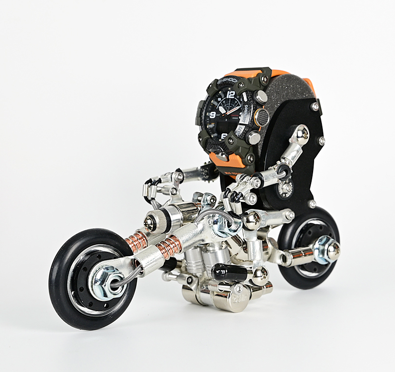 RoboBike watch stand with orange and black robot head, silver metal motorcycle chassis and wheels, desk display accessory