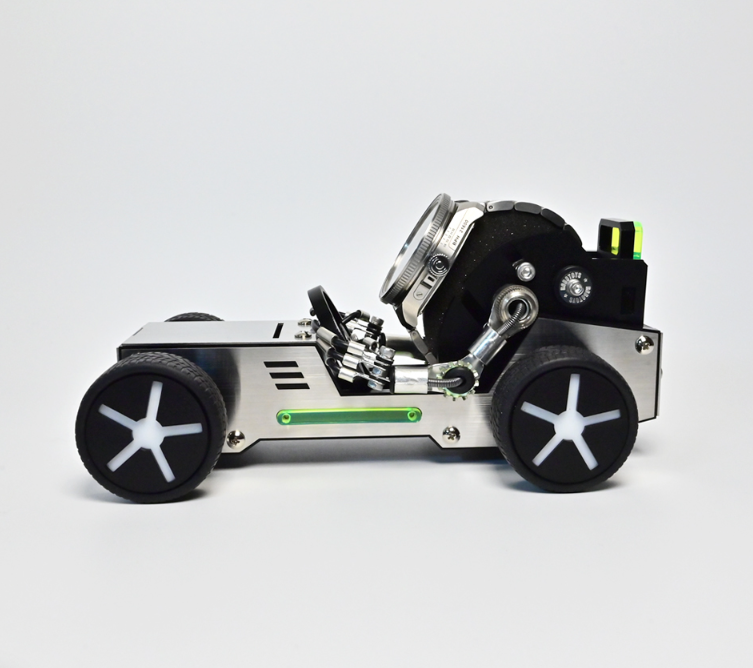 White and silver robotic roadster car watch stand holding multiple watches with black wheels and green accents