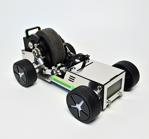 Green and white electric go-kart toy with large black wheels, motor and handle bar on white background