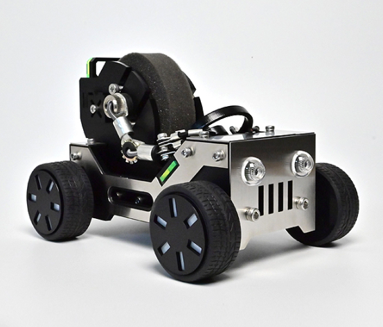 Black and silver robotic off-road vehicle with large black wheels, silver grille front, and articulated arm with watch stand attachment
