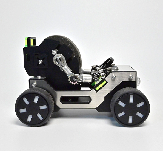 Robotic off-road vehicle watch stand with black wheels, silver chassis, and articulated mechanical arm holder