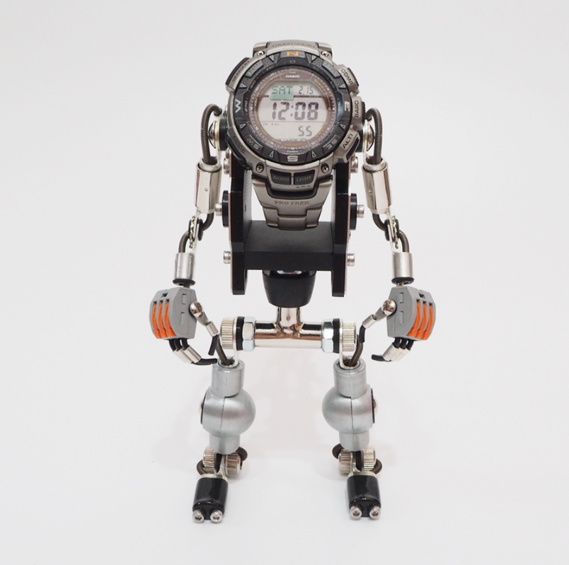 Silver RoboMech robot watch stand with articulated arms and legs, digital watch display on head