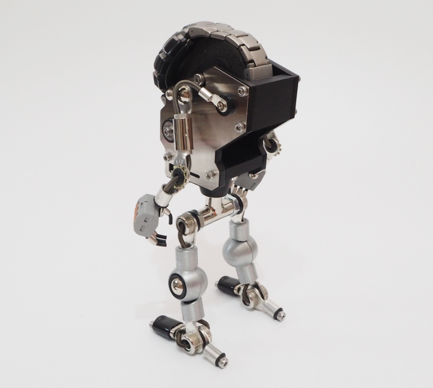 RoboMech silver watch stand with mechanical robot design, articulated metal limbs and digital watch head holder