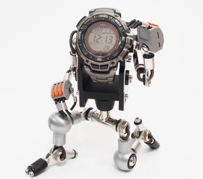 Silver RoboMech watch stand with articulated robot limbs holding digital sports watch, orange accents, front view