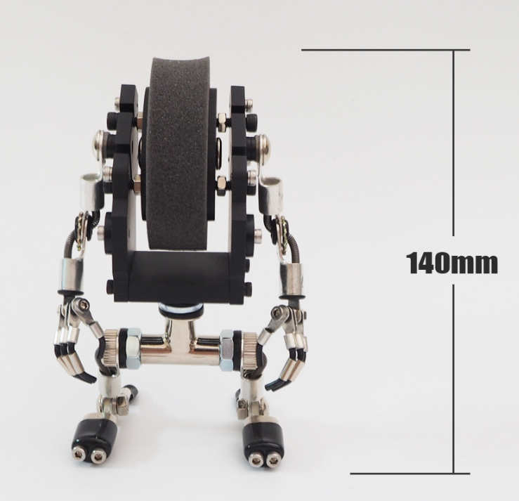 MiniMech black robot watch stand with articulated metal limbs and sanding wheel mechanism, 140mm height