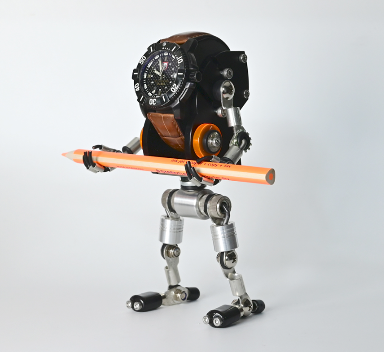 Black RoboMech watch stand holding sports watch with articulated metal legs and orange accessories