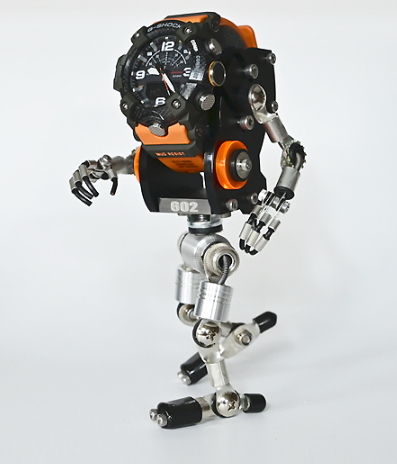 Black and orange RoboMech robot watch stand with articulated metal limbs and poseable joints on white background