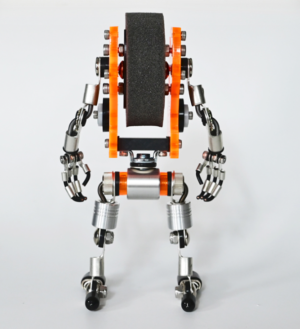 Orange and silver robotic watch stand with articulated limbs and grip hands, front view